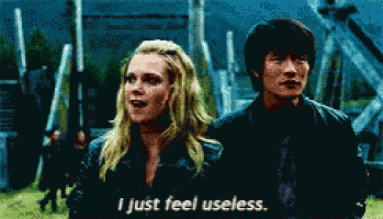 a man and a woman standing next to each other with the woman saying i just feel useless
