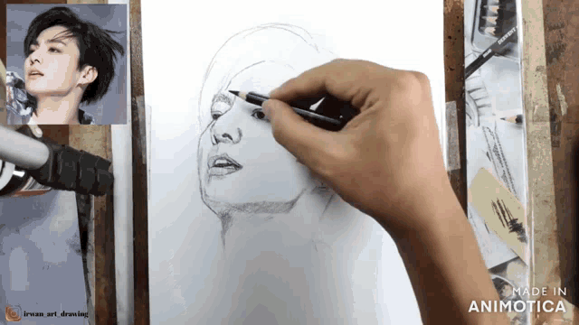 a drawing of a man 's face is being made in an animated video