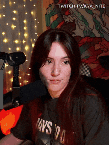 a woman wearing a t-shirt that says ' says 100 ' on it