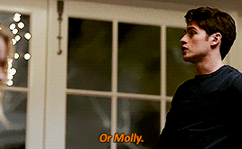 a man stands in front of a window and says " or molly " in orange letters