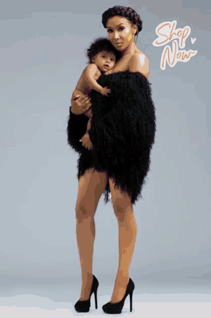 a woman in a black dress is holding a baby with the words mother 's da on the bottom