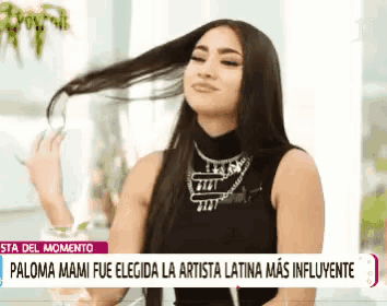 a woman 's hair is blowing in the wind with a headline that says paloma mami fue