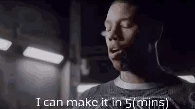 a man is standing in a dark room with his eyes closed and the words `` i can make it in 5 minutes '' .