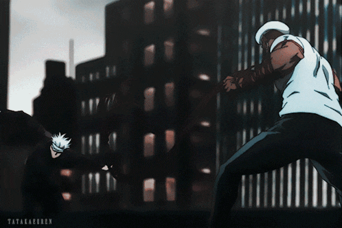 a man in a white shirt is fighting another man
