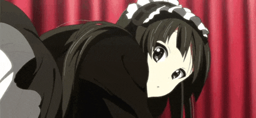 a girl in a maid costume is laying on the floor