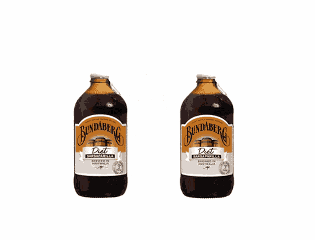 two bottles of bundaberg diet rum and vanilla are floating in the air