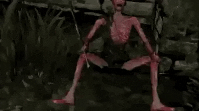 a bloody monster is holding a sword in his hands .