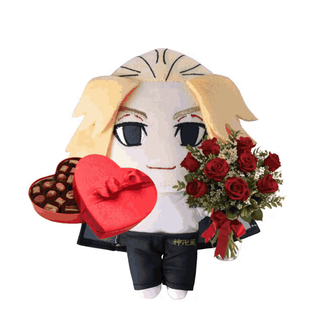 a stuffed animal with a heart shaped box of chocolates and a bouquet of roses
