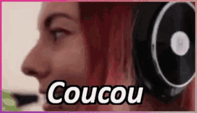 a close up of a woman wearing headphones with the words coucou written on it .