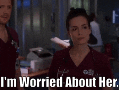 a woman in scrubs says i 'm worried about her while standing next to a man