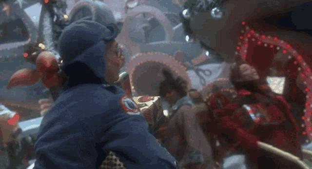 a man in a clown costume is holding a christmas present