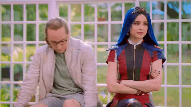 a man and a woman are sitting next to each other on a porch .