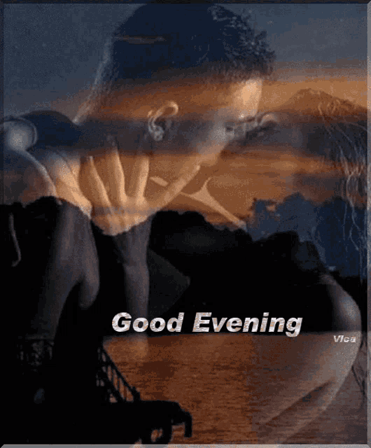 a picture of a man and woman kissing with the words good evening above them