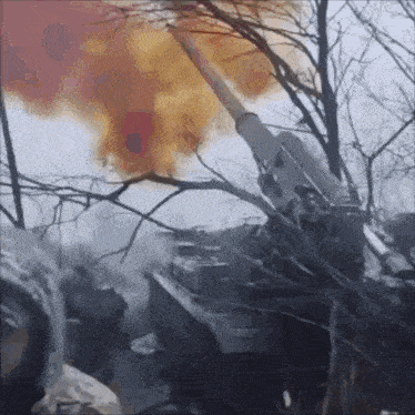 a cannon is being fired and smoke is coming out of the cannon
