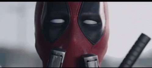 Deadpool Sniffs His Guns - Sniff GIF - Deadpool Ryan Reynolds Sniff GIFs