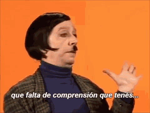 a woman with short hair and a mustache is talking in a foreign language .