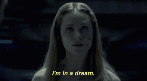 a woman in a dark room is saying i 'm in a dream .