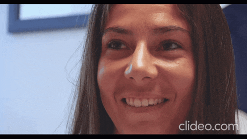 a close up of a woman 's face with clideo.com in the bottom right corner