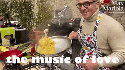a man is cooking on a stove with the words " the music of love " behind him