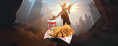 a cane 's drink sits next to a tray of fried chicken