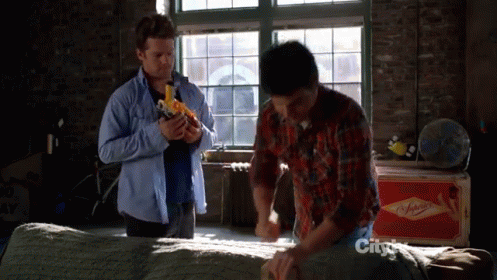 Gritty And Evocative GIF - Happy Endings Guns Nerf GIFs