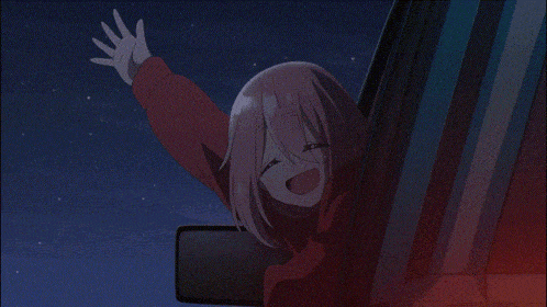 a girl with pink hair is sitting in a car