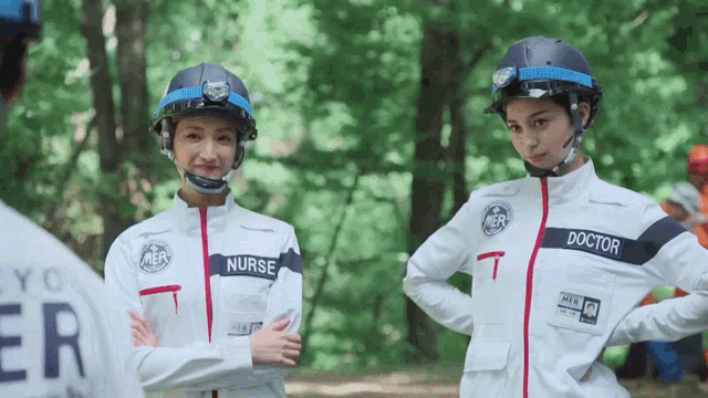 a nurse and a doctor are standing in the woods