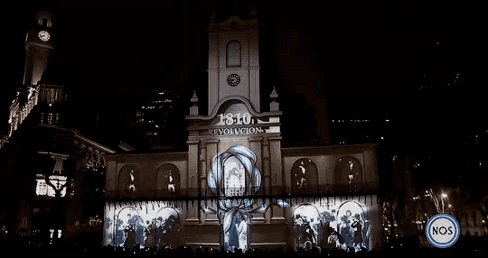 1810 revolucion is projected on a large building