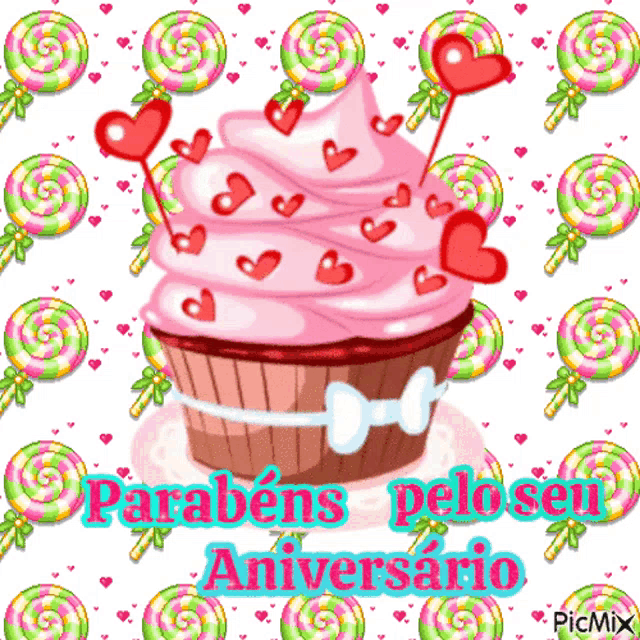 a picture of a cupcake with hearts and lollipops says parabéns pelo seu aniversario