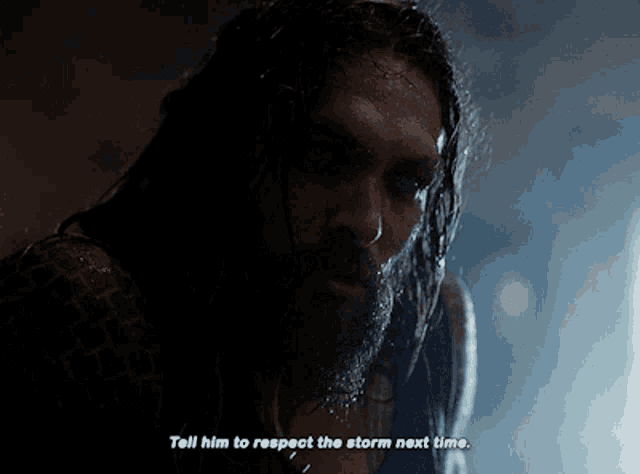 a close up of a man 's face with the words tell him to respect the storm next time