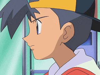 a close up of a boy wearing a hat