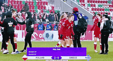 a soccer game is being played between poland and greece and the score is 2-0