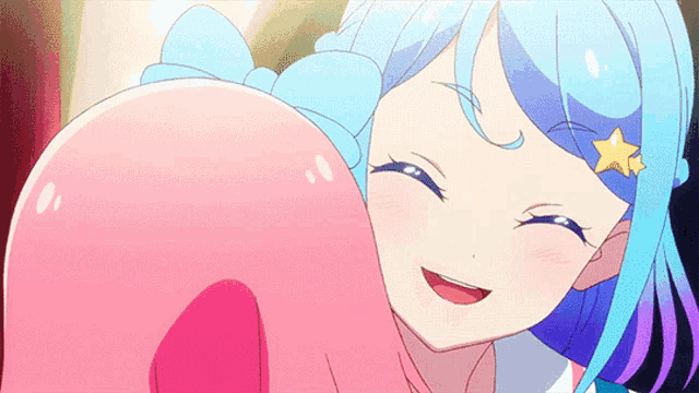 a girl with blue hair and a yellow star on her head