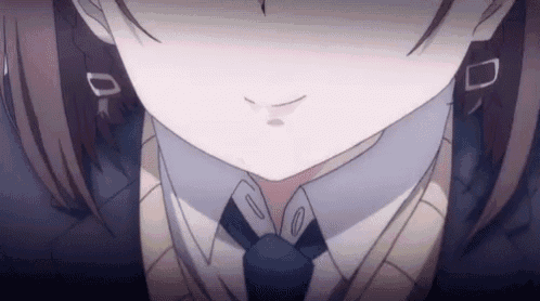 a close up of a girl 's face wearing a tie and sweater .