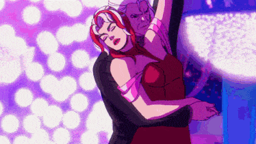 a man and a woman are dancing together in a club . the woman is wearing a red dress .