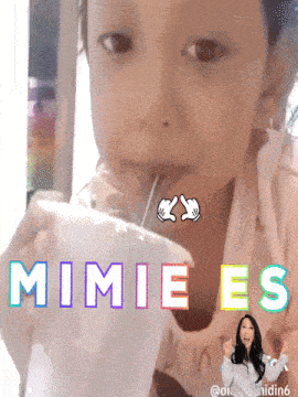 a little girl drinking from a cup with the words mimies written on it