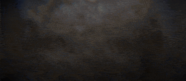 a blurred image of a person digging a hole with a shovel
