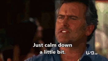 a man is saying `` just calm down a little bit '' while sitting in a bar .