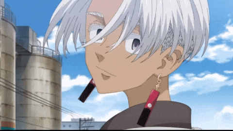 a cartoon character with white hair and red earrings stands in front of a silo