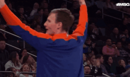 a man with his arms in the air with msg written on the bottom right