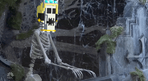 a skeleton is sitting in front of a waterfall with a nbc logo on the bottom