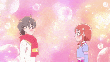 a boy and a girl are standing next to each other with bubbles behind them