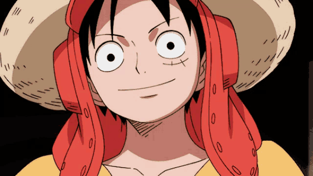 a cartoon character wearing a straw hat and a red scarf around his neck