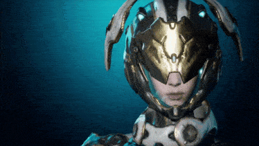 a close up of a person wearing a futuristic helmet with the letter o on it