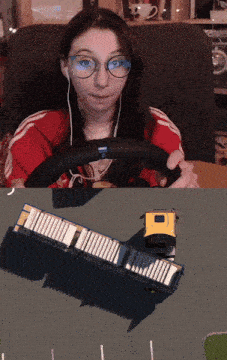 a girl wearing glasses and headphones is driving a truck