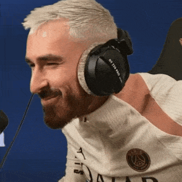 a man wearing headphones that say dt 1770 pro