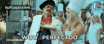 a man in a chef 's hat is holding a plate of food in front of a woman .