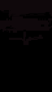 a man standing upside down in front of a house with his arms outstretched