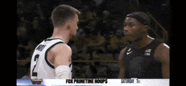 two basketball players standing next to each other with fox primetime hoops on the bottom