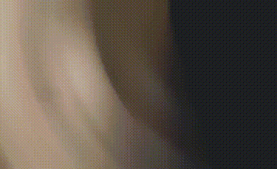 a close up of a person 's arm and a black background with dots .